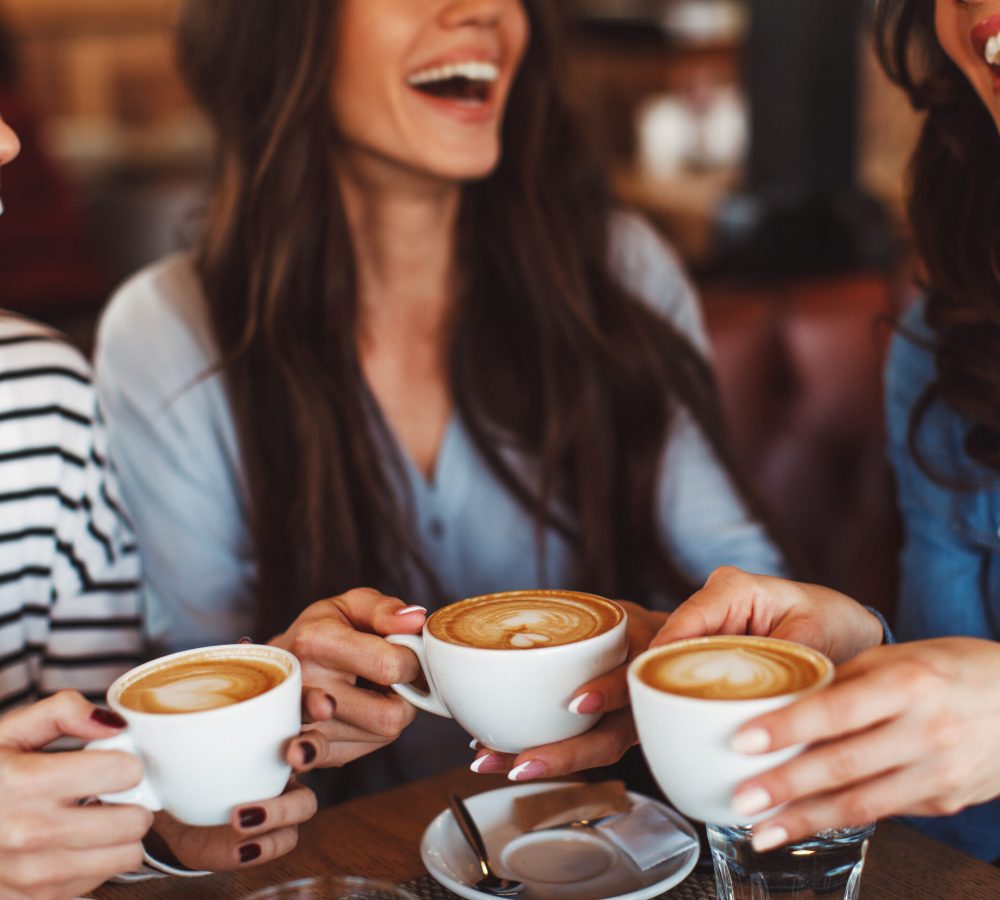 Three,Young,Women,Enjoy,Coffee,At,A,Coffee,Shop